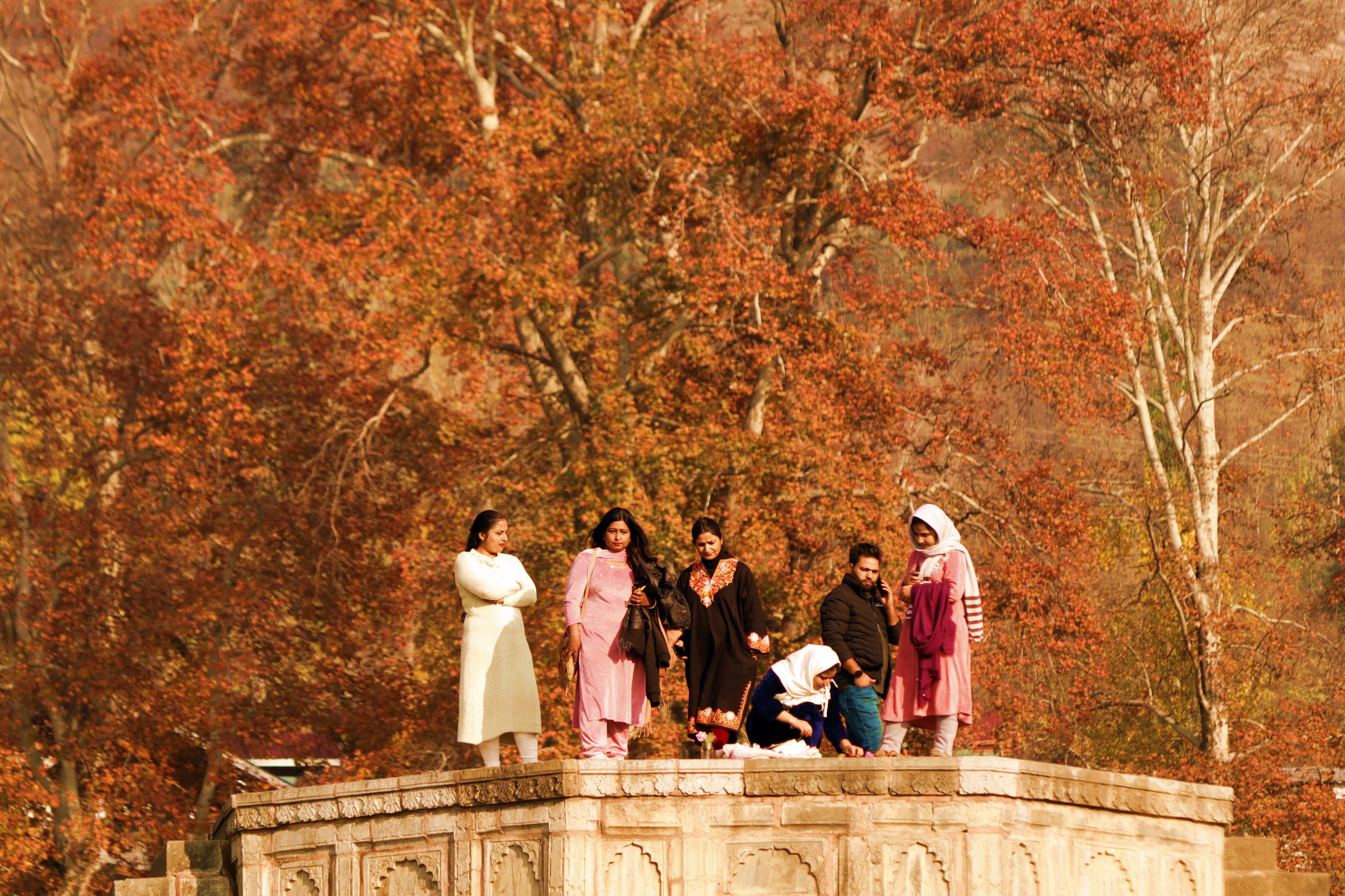 Young Kashmir women enjoying the scenic splendor of Kashmir's autumn